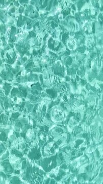 Swimming pool blue crystal transparent water abstract background texture.Summer vacation or relax concept,4k vertical video
