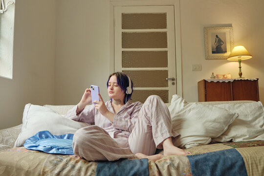 Cozy in the couch checking phone in the morning