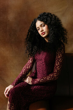 Woman with curly hair with sunlight