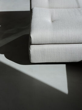 Abstract view of sofa with strong graphic shadows on the floor