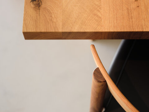 Close-up of wooden table with cropped design seat