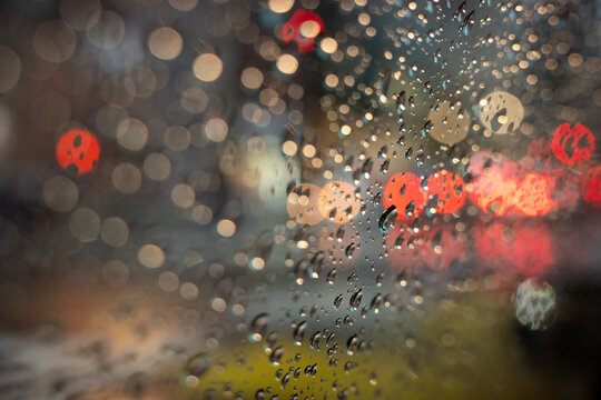 Raindrops on Window with City Lights