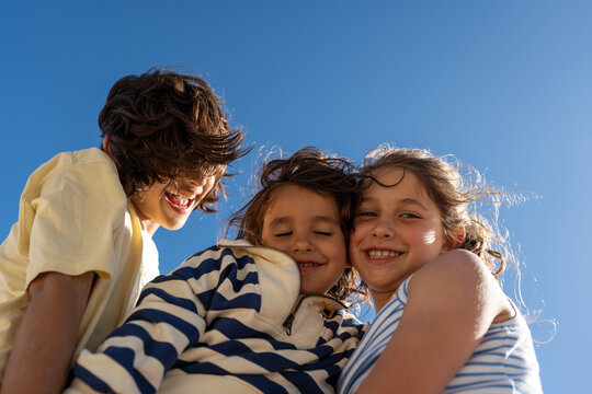 Happy children hugging together