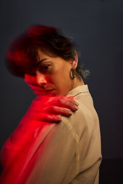 Portrait of a person with light effects in a dark setting