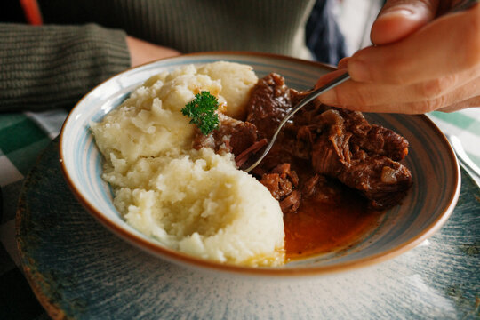 Eating Meal of Mashed Potatoes and meat