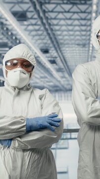 Vertical video Monitoring PCB smart factory workflow, EDA software on display and portrait of engineering team. Tracking microchip production circuit layout defects, simulation application and