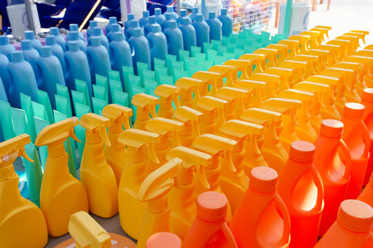 Vibrantly colored cleaning products arranged in an indoor exhibition