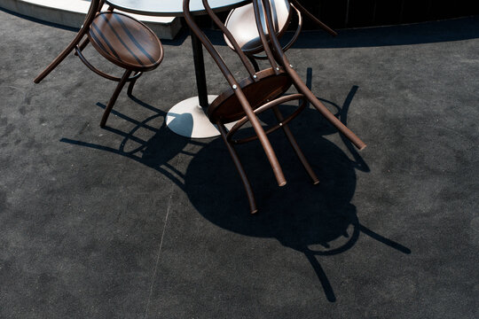 Chairs Stacked on a Round Table at an Outdoor Event Venue