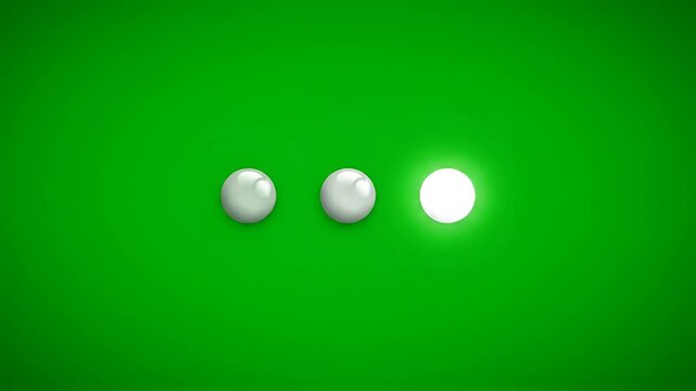 Three white balls on a green surface with a bright light in the middle.