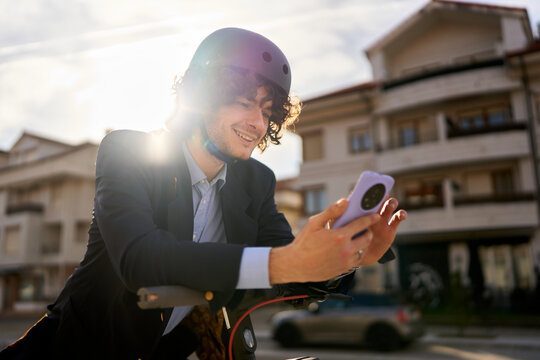 Man helmet electric scooter smartphone city commuting