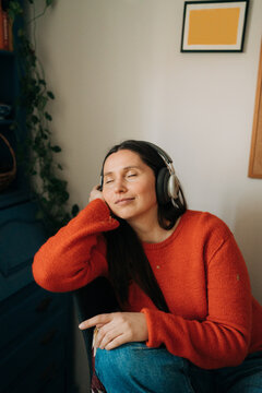 Relaxed Woman Listening to Music with Eyes Closed