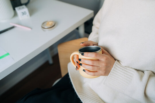 Close Up of Woman Holding Thermal Mug