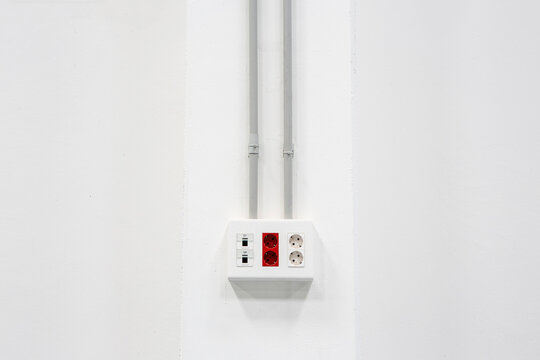 White plug on a wall