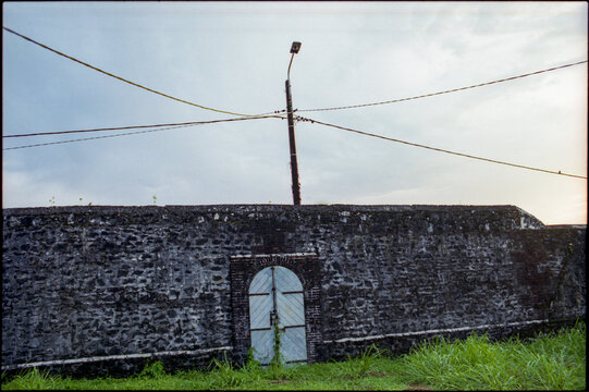 Entrance through a stone wall