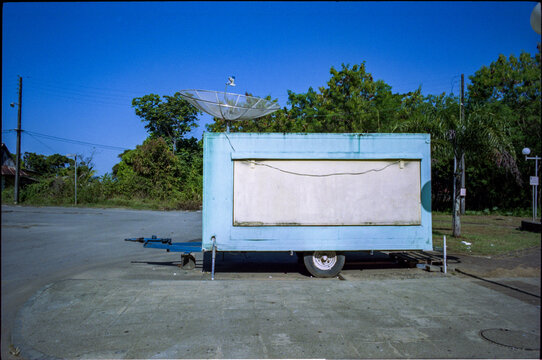 Old trailer with a satellite dish