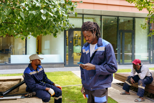 Urban tree maintenance between modern office buildings