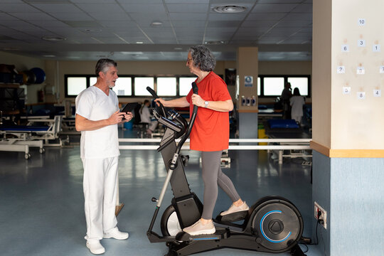 Senior woman doing physical rehabilitation with therapist
