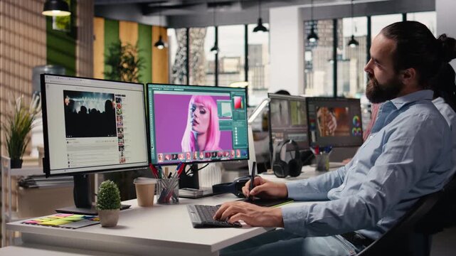 Male photographer working on image selection and editing in creative agency office, retouching photos with color grading on computer software. Commercial post production artistic tasks.