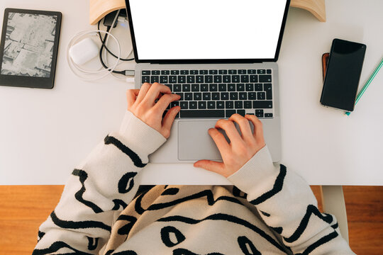 Close Up of Male Hands Typing on Laptop at Desk