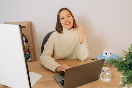 Smiling Woman Working Remotely From Home Office