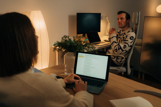 Female and male remote workers in home office