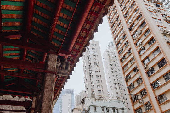 Traditional Temple Roof Beside Modern High Rise Buildings