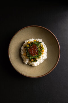 Salmon roe on rice with vegetables and herbs