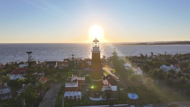 Sunset Punta Del Este Lighthouse In Maldonado Uruguay. Sunset Skyline. Beach Landscape. Downtown District. Punta Del Este Lighthouse In Punta Del Este In Maldonado Uruguay. Highrise Buildings.