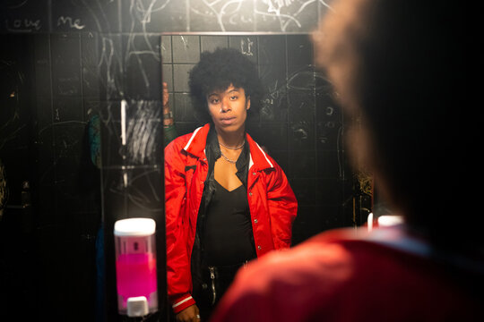 A beautiful woman in the bathroom of a party 