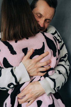 Man Smiling with Eyes Closed During Hug