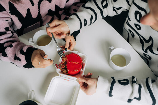 Overhead View of Couple Sharing Red Cake