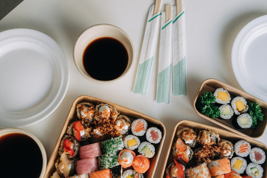 Sushi Takeaway Boxes with Soy Sauce and Chopsticks