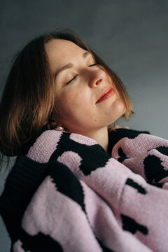 Relaxed Woman with Eyes Closed in Soft Natural Light
