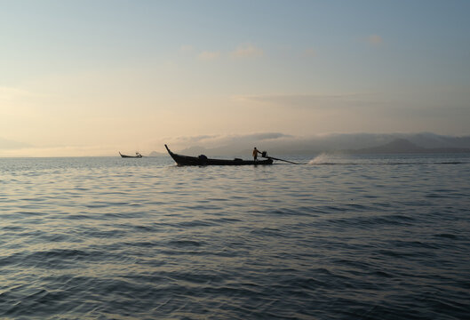 Long tailed fishing boat at dawn, Thailand.