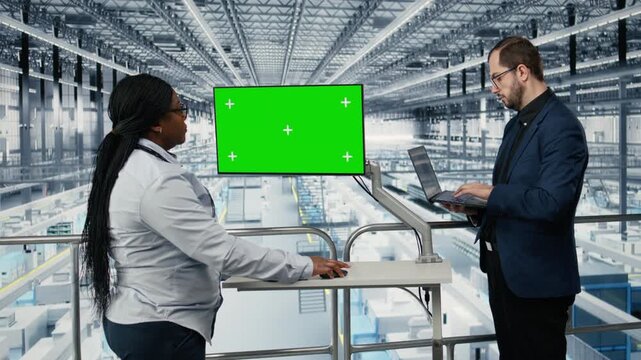 Isolated screen display used by coworkers in microchips plant to monitor fabrication yield data. Chroma key monitor used by businesspeople visualizing semiconductors factory bottlenecks, camera A