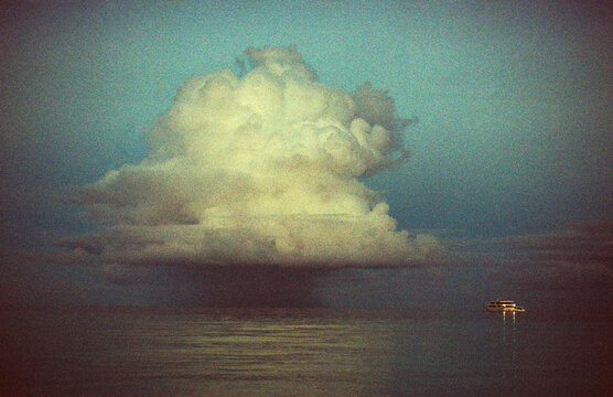 Yacht Under Storm Cloud