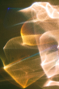 Light patterns play on a surface during a late afternoon indoor scene