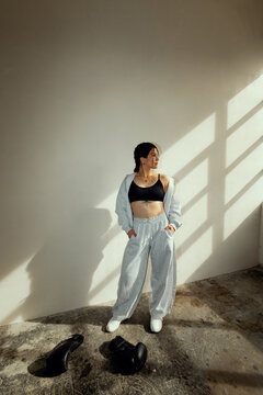Female boxer standing confidently