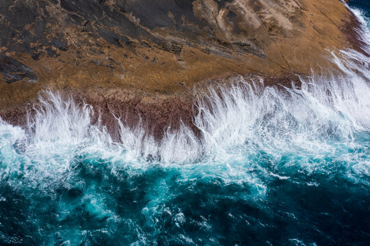 Waves smashing onto rocks. Whalers Way. South Australia.