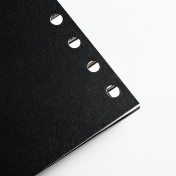 Black Binder Divider with Tabs and Punch Holes Top View on White