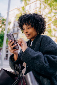 A woman using a mobile phone in the city
