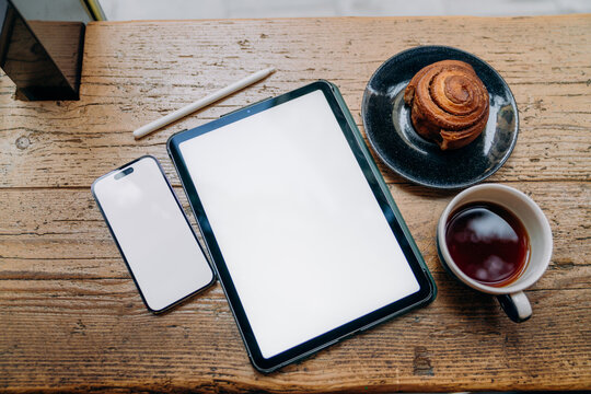 Mobile phone and tablet in the cafe