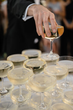 Champagne tower celebration at an outdoor event