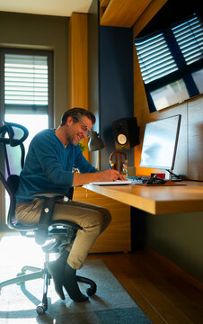 Man working at desk in bright home office space