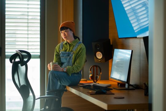 Tired woman taking break at home office desk