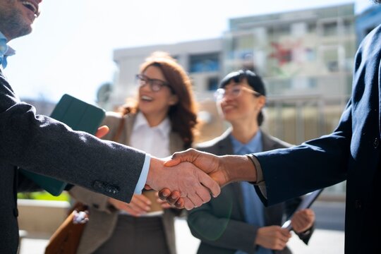 Business attendees shaking hands