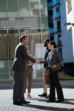 Business meeting takes place outside in the city