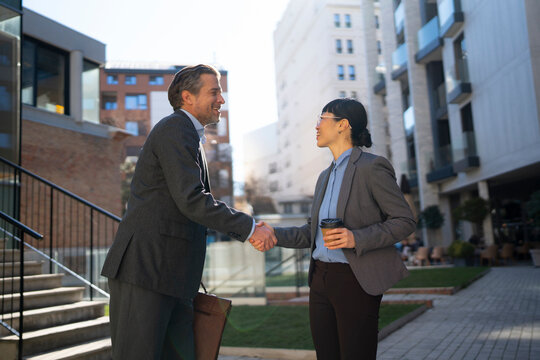 Business meeting in a city setting with handshake