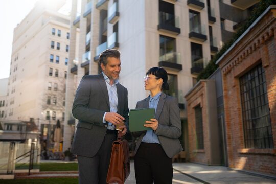 Business meeting in a city setting on a sunny day