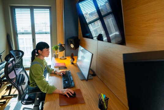 Working at a desk in a modern office space